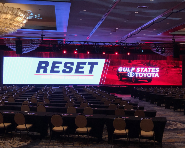 Ballroom setup for Gulf States Toyota 2020 Dealer Meeting, featuring a large LED screen with 