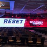 Ballroom setup for Gulf States Toyota 2020 Dealer Meeting, featuring a large LED screen with "RESET" theme and rows of empty chairs.