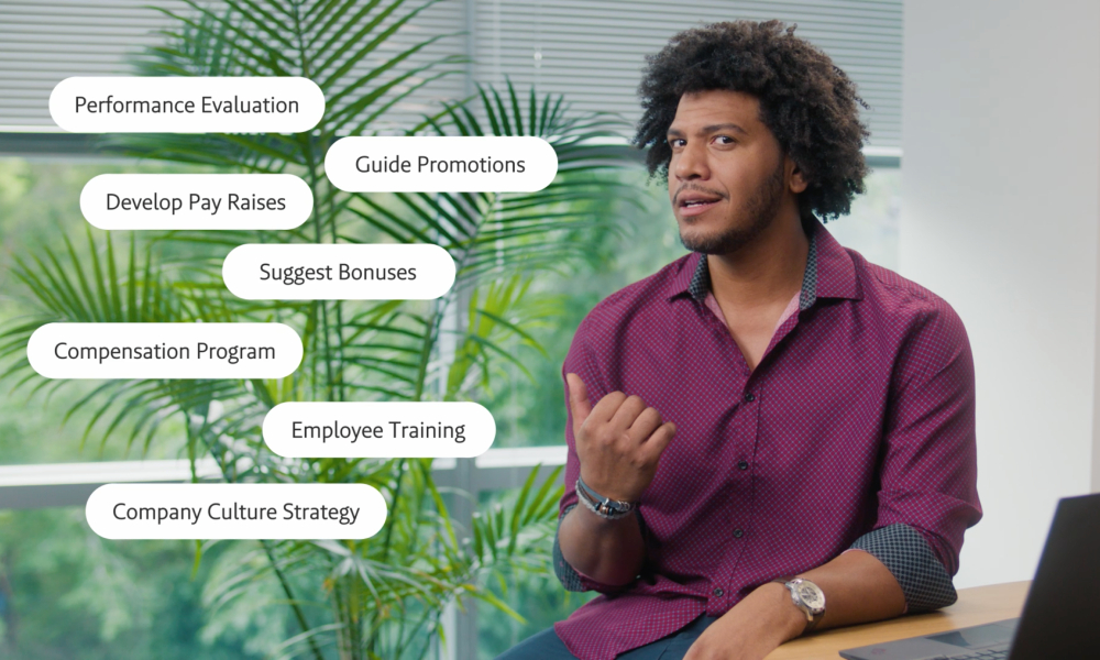 A man gestures while discussing HR topics, with motion graphics highlighting 